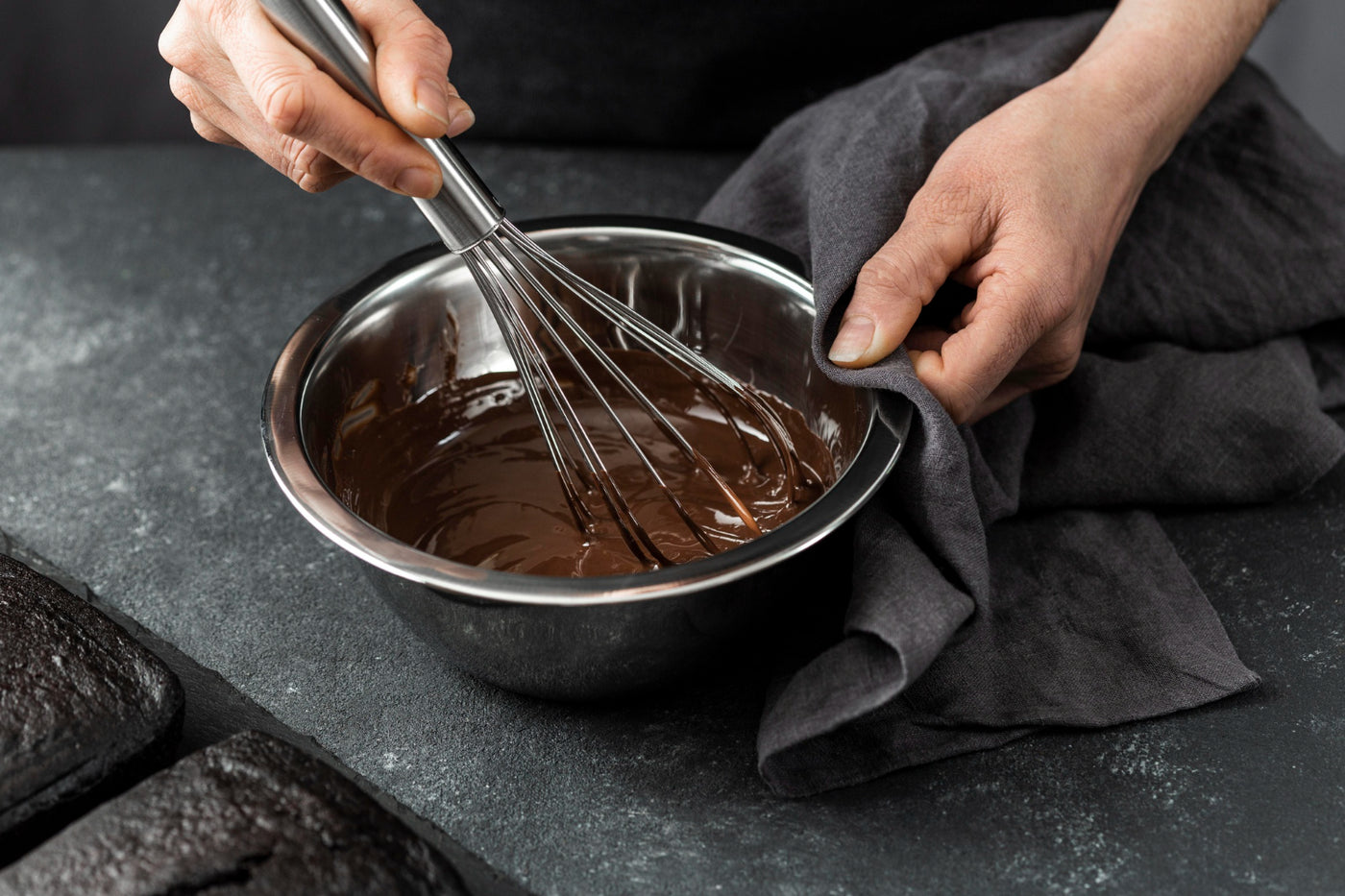 stefanelli's candies chocolate for baking person mixing melted chocolate with whisk